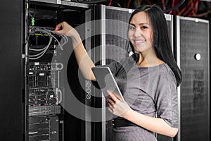 Engineer businesswoman in network server room