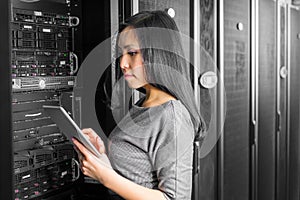 Engineer businesswoman in network server room