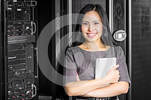 Engineer businesswoman in network server room