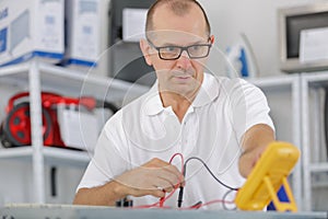 Engineer calibrating a machine