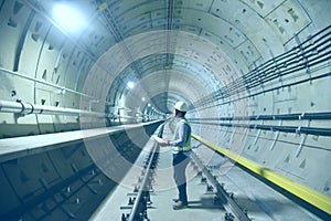 Engineer check concrete structure in the tunnel underground construction.the  background concept for  train railway engineering tr photo