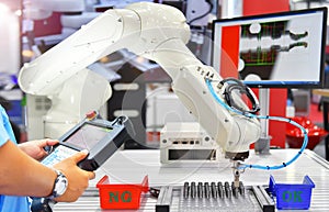 Engineer check and control automation Modern Robot system in factory