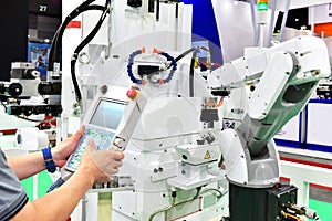 Engineer check and control automation white Modern Robot Arm system in factory