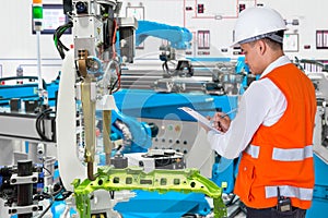 Engineer check maintenance daily of automated automotive robot