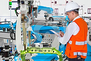 Engineer check maintenance daily of automated automotive robot photo