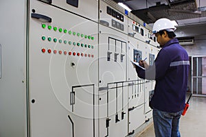 Engineer checking the electrical system in the control room