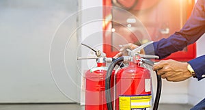 Engineer checking Industrial fire control system are checking fire extinguishers.