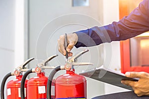 Engineer checking Industrial fire control system are checking fire extinguishers.