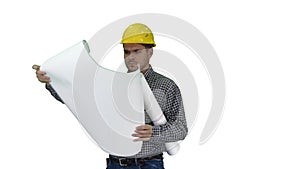 Engineer checking plan on construction site on white background.