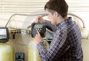 Engineer checking pressure meters at factory