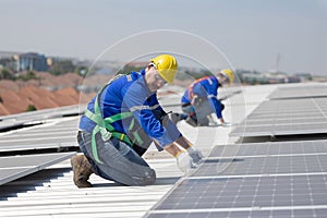 Engineer checking on solar panel on the factory rooftop