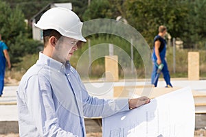 Engineer checking specifications on a plan