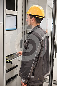 Engineer commissioning bay control unit. Engineering department photo