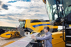 Engineer configures agricultural machinery