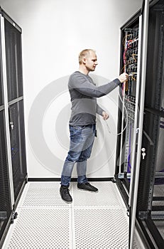 IT engineer connecting network in datacenter