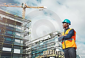 Engineer, construction and a man thinking of development at building site with architecture. Black male contractor happy