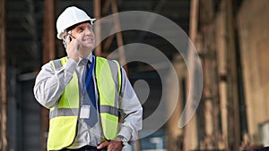 Engineer, construction and phone of a man outdoor for building project management. Senior contractor person talking to