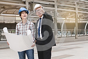 Group of happy builder construction people talking and planning work schedule.