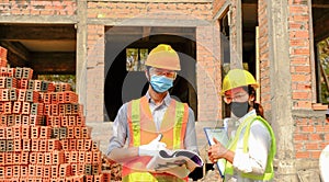 Engineer contractor team meeting work safety plan industry project and check design at the construction building site