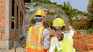 Engineer contractor team meeting work safety plan industry project and check design at the construction building site