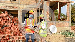 Engineer contractor team meeting work safety plan industry project and check design at the construction building site