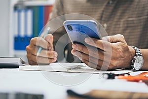 Engineer contractor using phone at site working