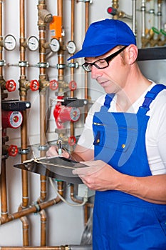 Engineer controlling the heating system