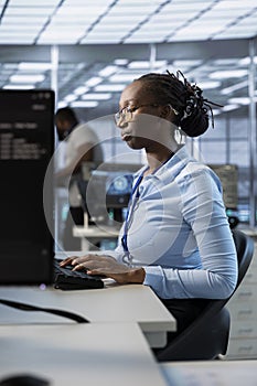 Engineer in data center managing and optimizing large scale IT infrastructure