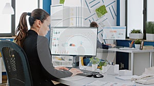 Engineer designing data charts on computer for business project