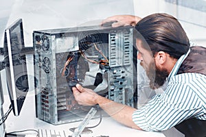 Engineer disassembling CPU, double exposure