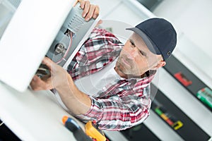 engineer disassembling cpu double exposure