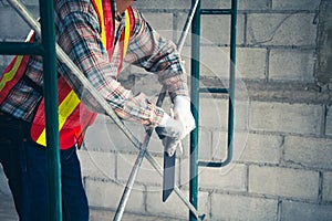 The engineer documents the quality inspection findings using a tablet