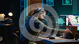 Engineer with EEG headset on merging with artificial intelligence