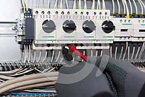 Engineer electrician is testing an electric machine