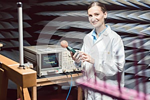 Engineer in electronics lab performing rf compliance test