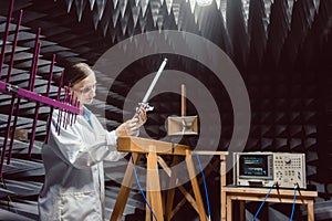 Engineer in electronics lab performing rf compliance test