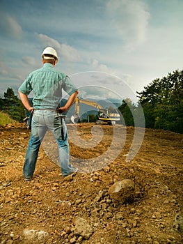 Engineer evaluating construction progress