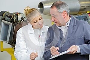 engineer with female engineer apprentice