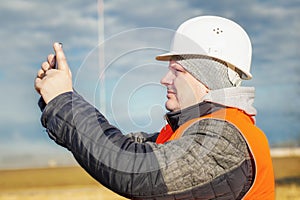 Engineer filmed with tablet PC at outdoors