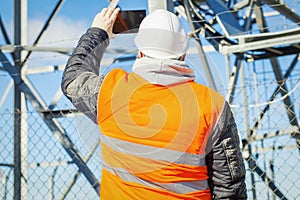 Engineer filmed with tablet PC at outdoors