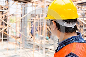 Engineer / foreman checking and planning project at construction site