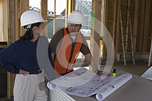 Engineer And Foreman In Discussion At Site