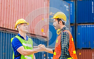 Engineer and foreman worker handshake with blurred construction site, Success and Teamwork concept