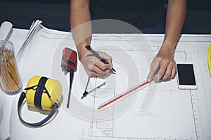 Engineer hand inspector and checklist blueprint on construction site. Safety Officer writing drawings paper. Safety Officer Civil