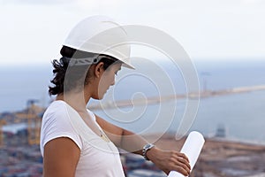 engineer with hardhat watching the clock