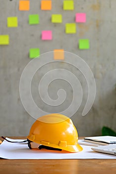 Engineer helmet on table with pc