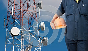 Engineer holding orange helmet on Telecommunications tower