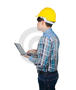 Engineer while holding using Laptop and head wear yellow safety helmet plastic . Concept Work construction on white background