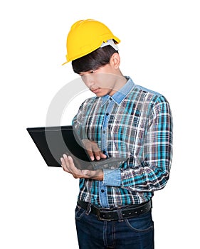 Engineer while holding using Laptop and head wear yellow safety helmet plastic. Concept Work construction on white background