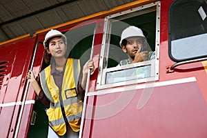 Engineer holding a walkie-talkie in the control room